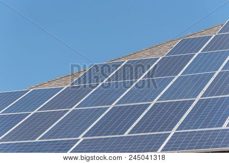 Solar Panel Installation On Asphalt Shingles Rooftop