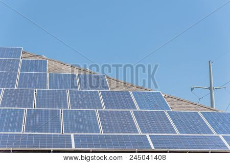 Solar Panel Installation On Asphalt Shingles Rooftop