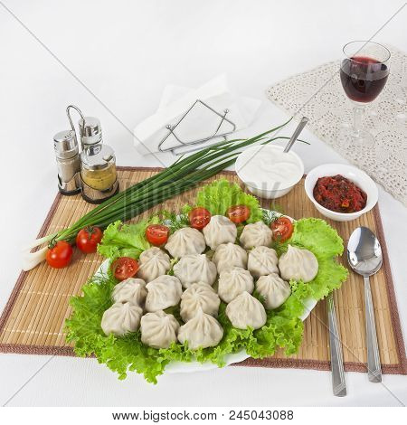 Kinkali In Green With Tomatoes And Onions. Serve With Soy Sauce And Sour Cream.