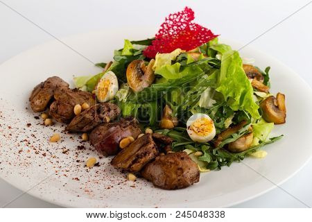 Salad With A Liver Close-up On A White Background.