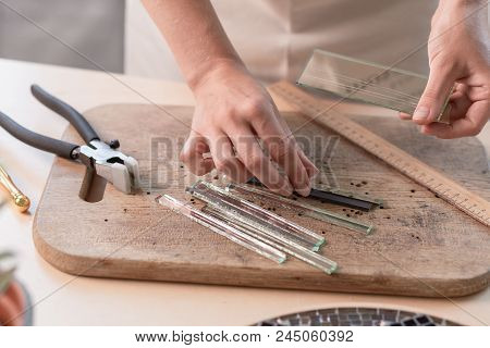 Workplace Of The Mosaic Master: Women's Hands Holding Tool For Mosaic Details In The Process Of Maki