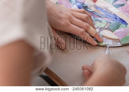 Workplace Of The Mosaic Master: Women's Hands Holding Tool For Mosaic Details In The Process Of Maki
