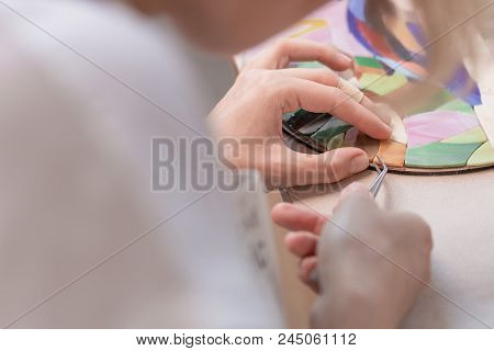 Workplace Of The Mosaic Master: Women's Hands Holding Tool For Mosaic Details In The Process Of Maki