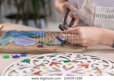 Workplace Of The Mosaic Master: Women's Hands Holding Tool For Mosaic Details In The Process Of Maki