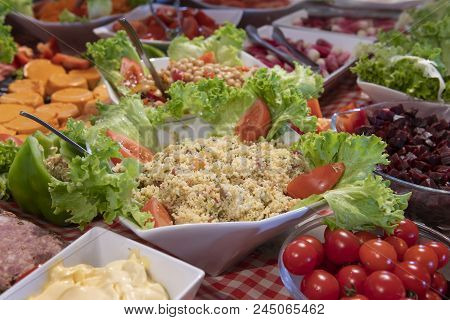 Tasted And Various Food And Salads, Tomatoes, Taboule, Sals In A Restaurant Table
