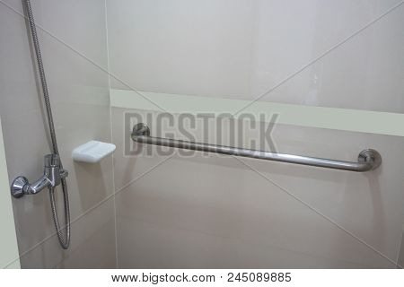 Bathroom Interior In Patient Room With Basic Required Equipment. Modern Design In Beige Color.