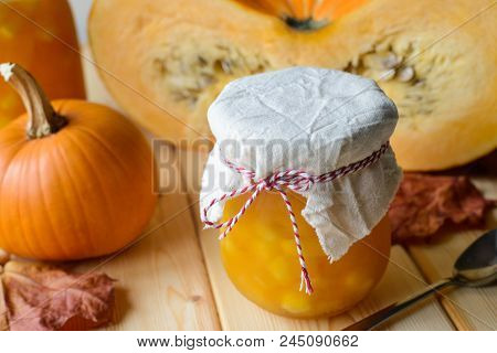 Autumn Still Life Of Homemade Pumpkin Jam On Natural Wood Table, Stock Photo Image