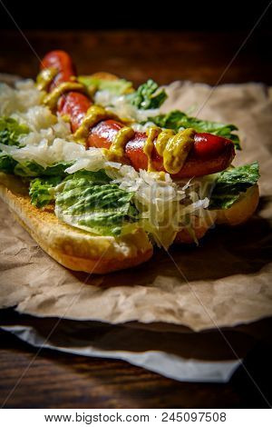 Fancy Grilled Hotdog With Sauerkraut Lettuce And Spicy Mustard