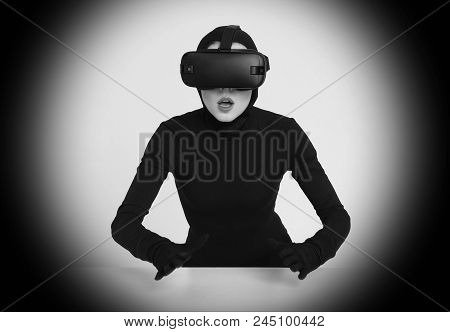 An Excited Girl In A Black Suit Wears Vr Headset To Experience The New Technoligies Of Vitrual Reali