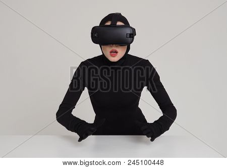 An Excited Girl In A Black Suit Wears Vr Headset To Experience The New Technoligies Of Vitrual Reali