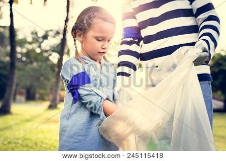 Kids picking up trash in the park