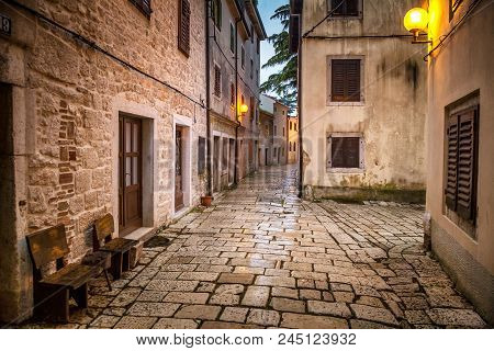 Street In Porec Town Illuminated By Lamps At The Evening, Croatia, Europe.