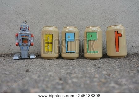 Beer Text Painted Over Beer Cans With A Tin Toy Robot