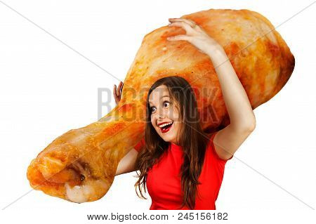 Cute Funny Young Girl Holds On Shoulder Huge Grilled Chicken Leg , Isolated On A White Background