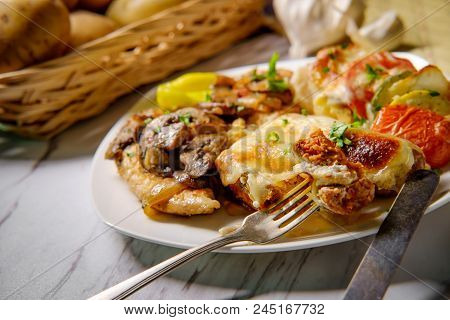 Italian Chicken Marsala With French Vegetable Tian And Stuffed Sausage