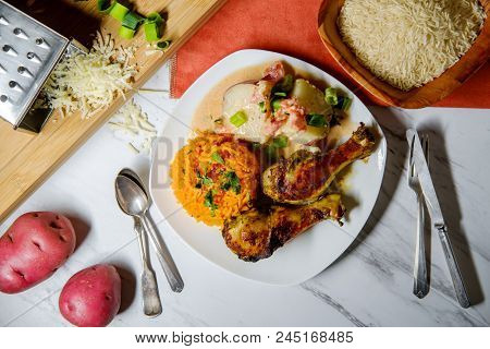 Colombian Cuisine Papas Chorreadas Roasted Chicken Legs And