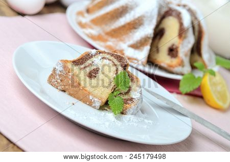 Cut Of Marble Cake Sprinkled With Sugar, Milk, Eggs, Melissa And Leaves, , Still Life With Marble Ca
