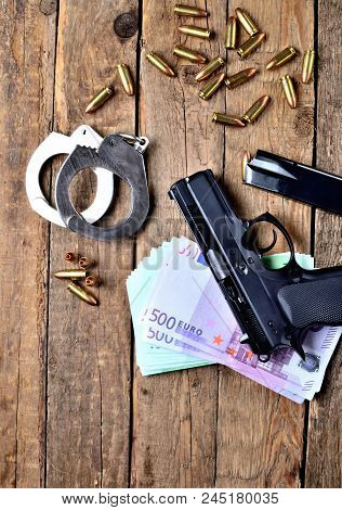View From Above Of 9mm Pistol Gun - Handgun, Handcuffs, Special Police Hollow-point Expanding Bullet