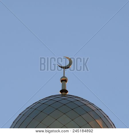 The Symbol Of Islam Is A Golden Crescent Moon On Top Of The Mosque Minaret On The Blue Evening Of Th