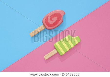 Ice Cream Popsicles Lollipops On A Pastel Blue And Pink Background Ready For Summer.  Wooden Toy Ice