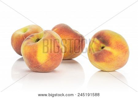 Four Ripe Yellow Peaches Isolated On White Background