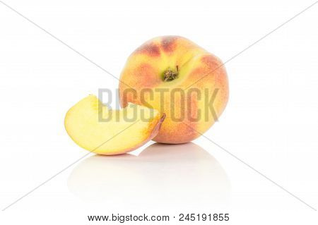 One Yellow Peach And A Slice Isolated On White Background