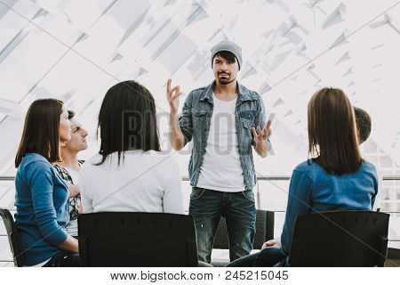 Young Bearded Man Shares Problems With Other People. People In Circle Listen To Man.support Group.