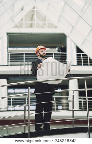 Young Developer Near Building. Engineer In Helmet. Business Theme.