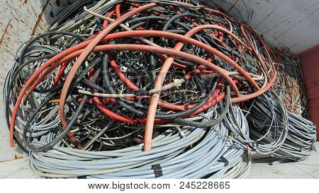 Heap Of Abandoned Electric Wires In The Big Container