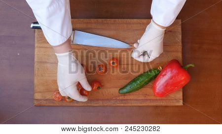 Cutting Tomatoes For Dishes On The Table. Close Up. Top