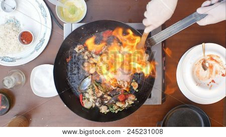 Fresh Seafood In The Frying Pan On Fire. Close Up