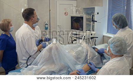 Medical Team Conducting Surgery Using Endoscope. Timelapse. Professional Shot In