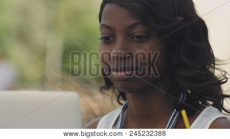 Beautiful Woman Having Video Chat On Laptop Computer Outsite In