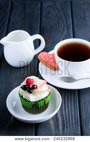 A Cup Of Fragrant Tea With Delicious Cake In White Dish