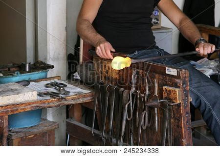 Glass Artist In Her Workshop Making Glassware
