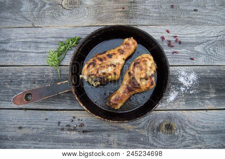 Grilled Chicken Legs With Spices And Herbs On Apan On Wooden Board