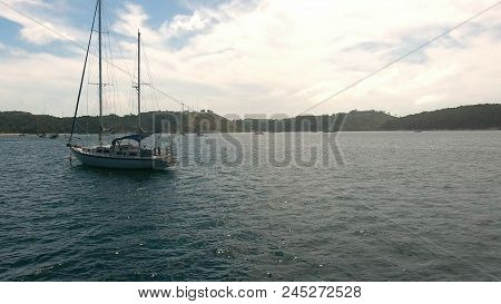 Copter Fly Over The Yacht Moored In A Bay Near