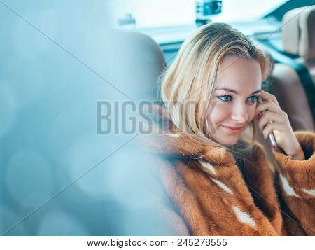 Portrait Of A Blue-eyed Blonde. Beautiful Girl Looking At The Camera. Woman With Loose Hair