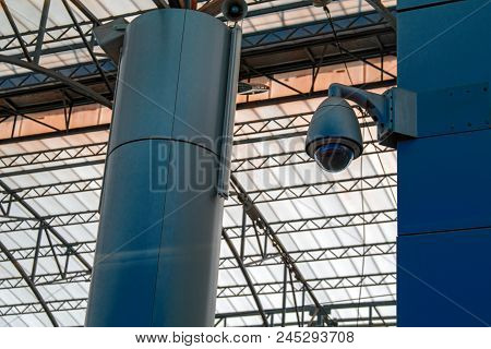 Video Surveillance System At The Station. Protected Video Camera Mounted On A Support. Concept Of Se