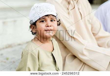 Happy Muslim boy with his family