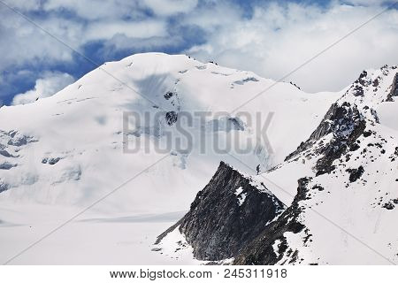 Snowy Peak In The Mountains