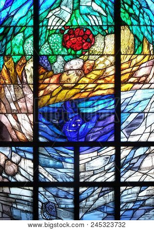 LEUTERSHAUSEN, GERMANY - JULY 05: The Story of Creation, stained glass window by Sieger Koeder in church of Saint Bartholomew in Leutershausen, Germany on July 05, 2017.