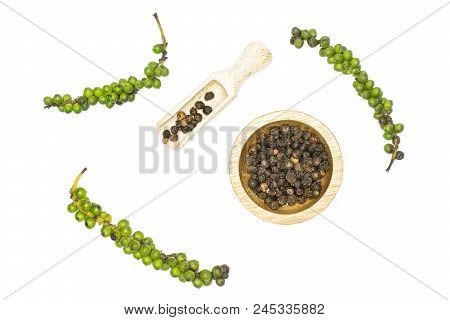 Unripe Drupes Of Fresh Black Pepper Top View Isolated On White Backgound Four Bunches One Wooden Bow