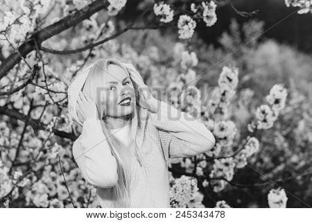 Knitten Things. Woman Or Smiling Girl With Red Lips And Blonde Hair Outdoor In Bird Cherry Blossom W