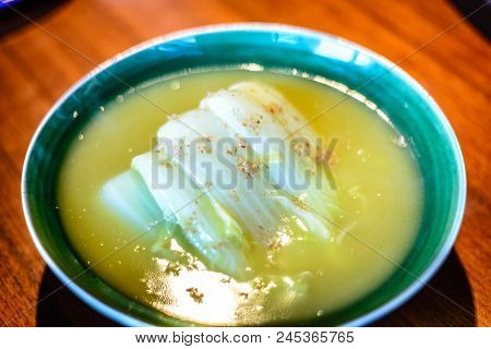 Seasonal White Bok Choy Cabbage Cooked In  A Duck Bouillon Served In Porcelain