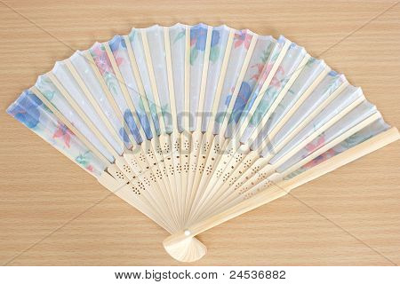 Paper Fan Lie On A Table
