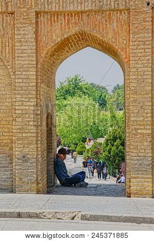 Isfahan, Iran - May 8, 2015: People Resting And Enjoying The View Of The Zayandeh River From The Anc