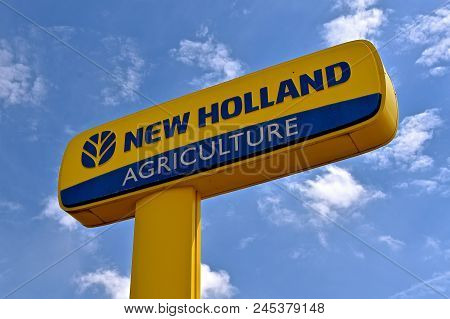 Rapid City, South Dakota, May 22, 2018: The New Holland Sign Advertises The Products Of Global Brand