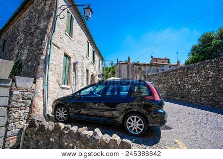 Arka Petrarka, Italy - June, 13, 2018: car stands on a parking in an old town in Arka Petrarka, Italy