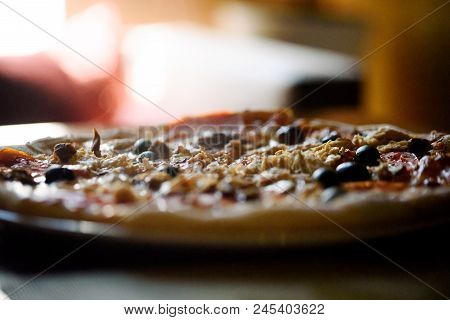 Hot Appetizing Pizza On The  Table In Bar